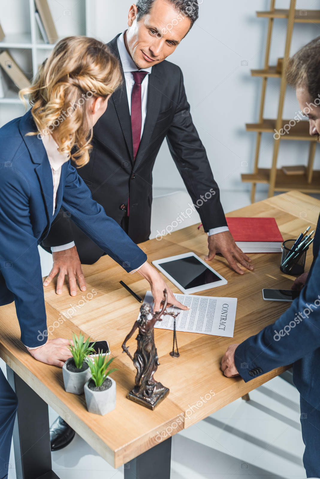 depositphotos 174274458 stock photo lawyers discussing contract in office