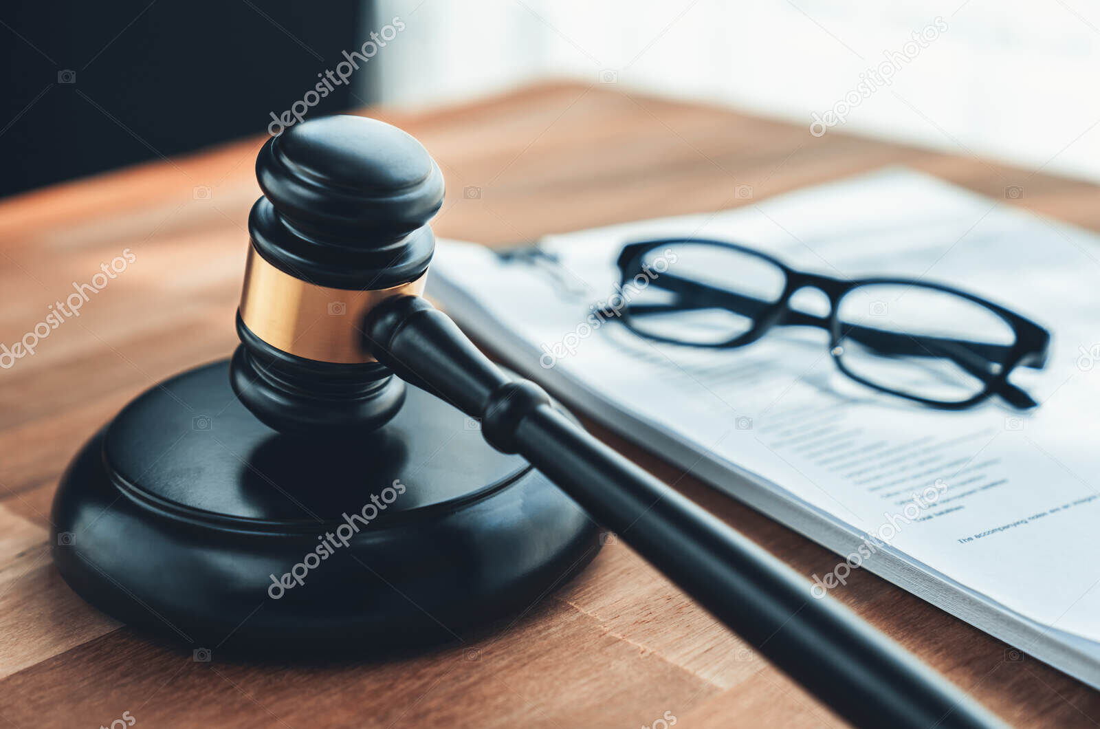 Black wooden gavel and paper on office desk as justice and legal. equility